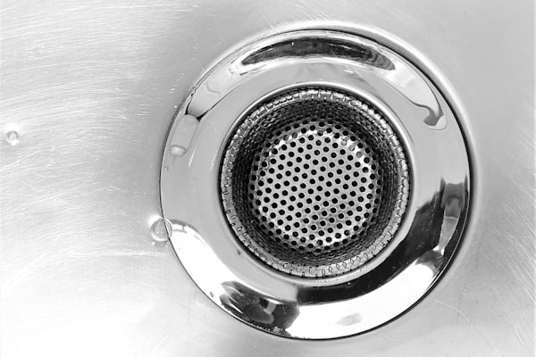 Stainless steel sink drain closeup