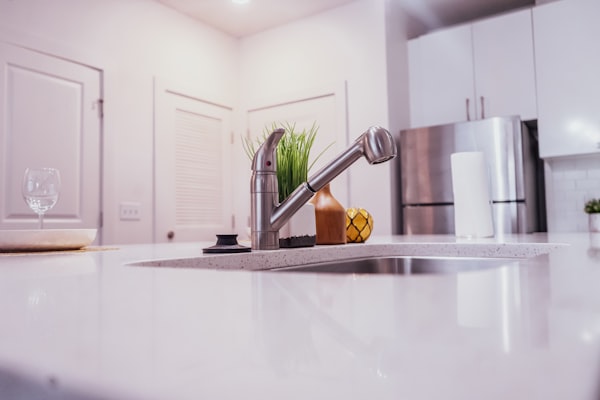 Modern kitchen with stainless steel sink and faucet